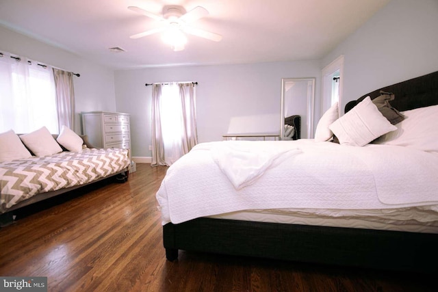 bedroom featuring ceiling fan and hardwood / wood-style flooring