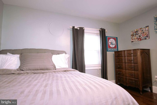 bedroom with wood-type flooring