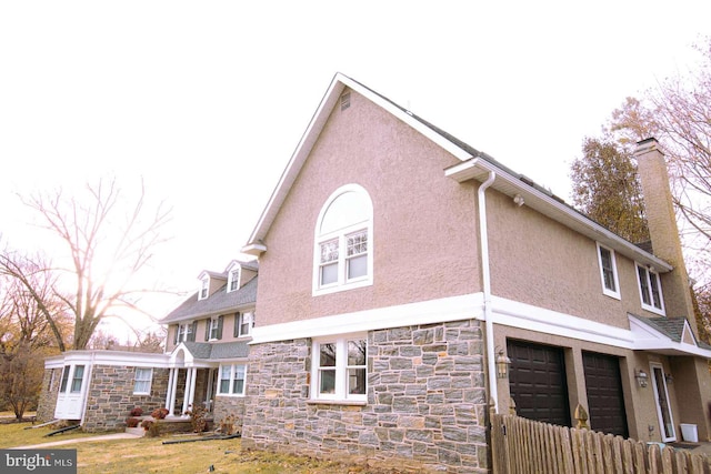 view of property exterior featuring a garage