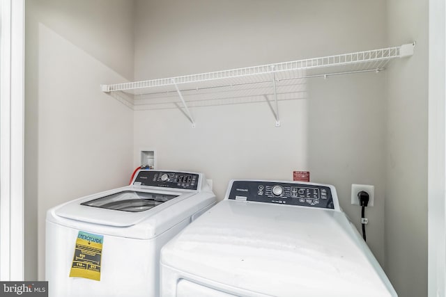 washroom featuring washer and dryer