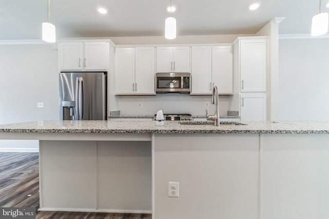 kitchen with white cabinetry, light stone counters, pendant lighting, and stainless steel appliances