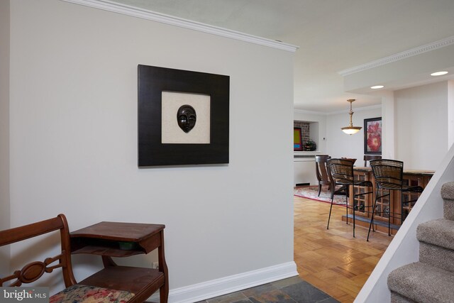 interior space featuring parquet floors and ornamental molding