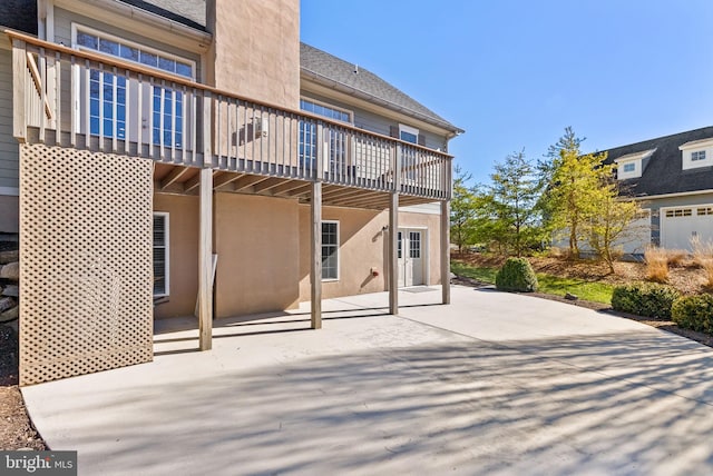 rear view of property featuring a patio area