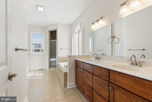 bathroom with vanity, plus walk in shower, and tile patterned flooring