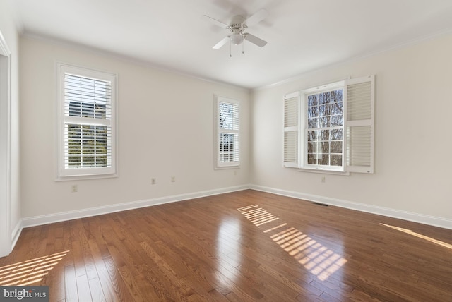 unfurnished room featuring dark wood-type flooring, ceiling fan, and ornamental molding