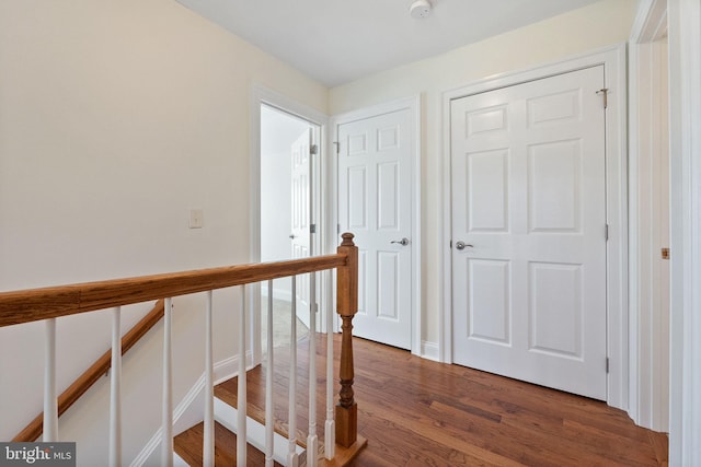 hall with dark hardwood / wood-style floors