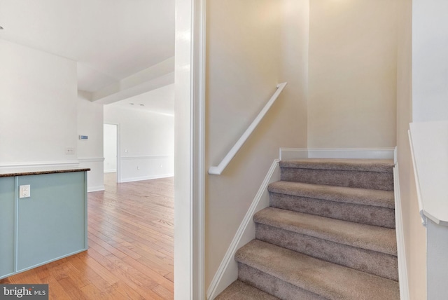 stairs with wood-type flooring