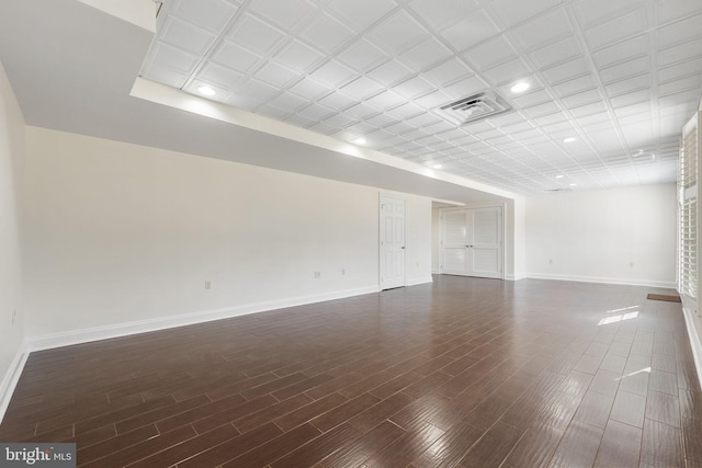 unfurnished room featuring dark wood-type flooring