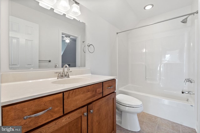 full bathroom featuring shower / washtub combination, toilet, ceiling fan, vanity, and tile patterned flooring