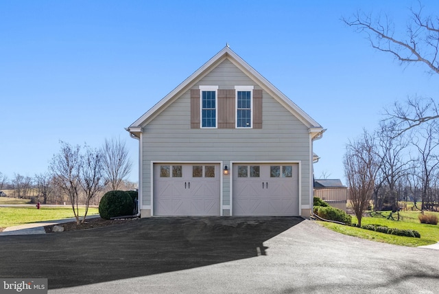 view of side of home with a garage