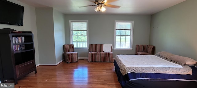 bedroom featuring hardwood / wood-style flooring and ceiling fan