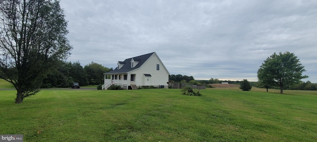 view of side of home featuring a yard