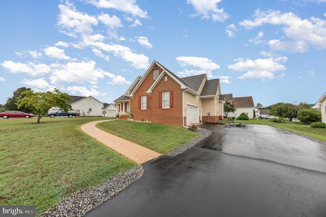 view of front of home featuring a garage and a front lawn