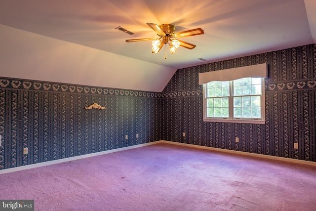 bonus room with vaulted ceiling, baseboards, visible vents, and wallpapered walls