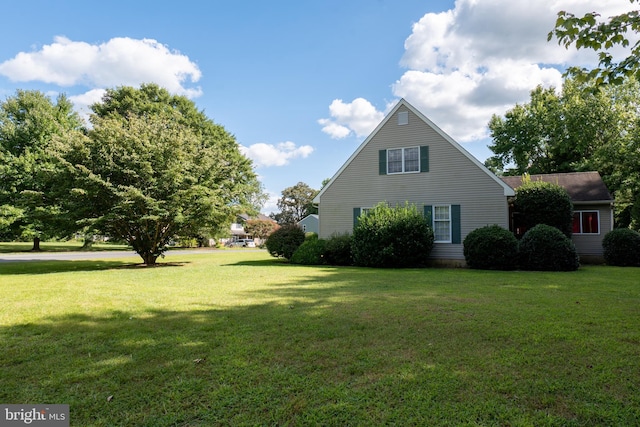 view of property exterior featuring a yard