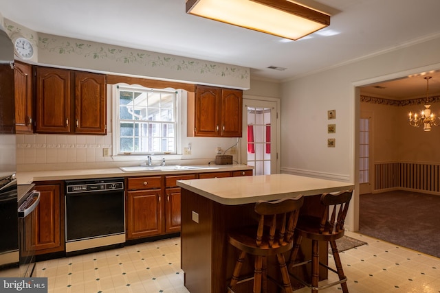 kitchen featuring dishwasher, light floors, a sink, and light countertops