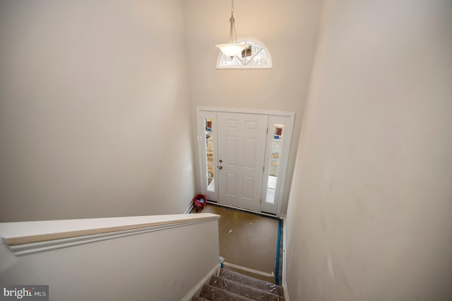 foyer with a towering ceiling