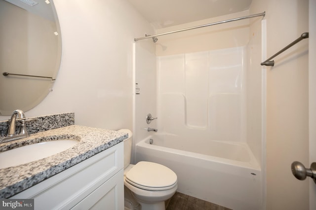 full bathroom featuring vanity, wood-type flooring, shower / bathing tub combination, and toilet