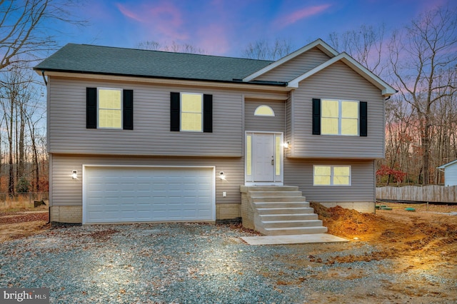 split foyer home featuring a garage