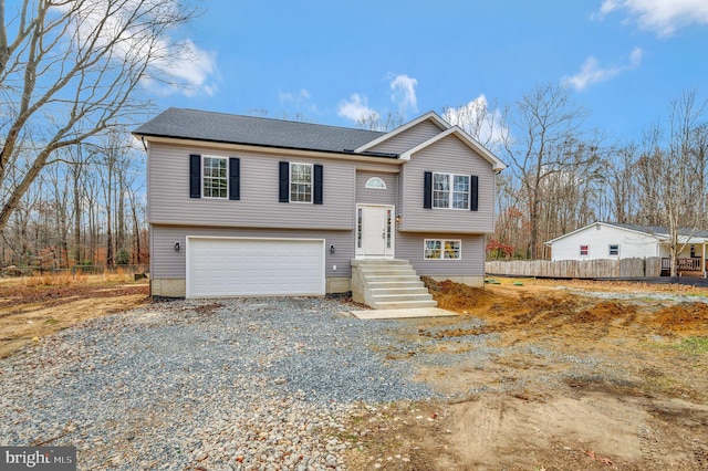 split foyer home featuring a garage