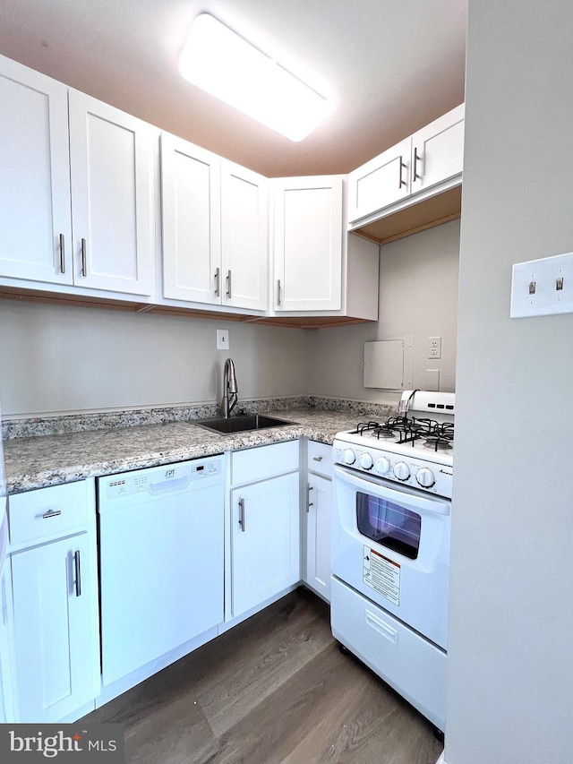 kitchen featuring dark hardwood / wood-style flooring, sink, white cabinets, and white appliances