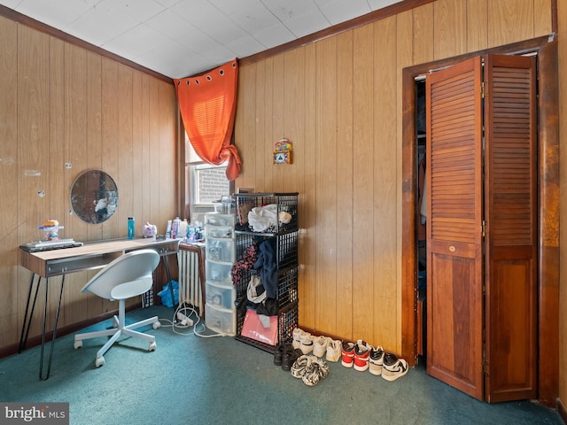 carpeted office with wood walls