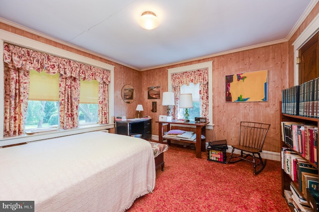 bedroom with crown molding and carpet