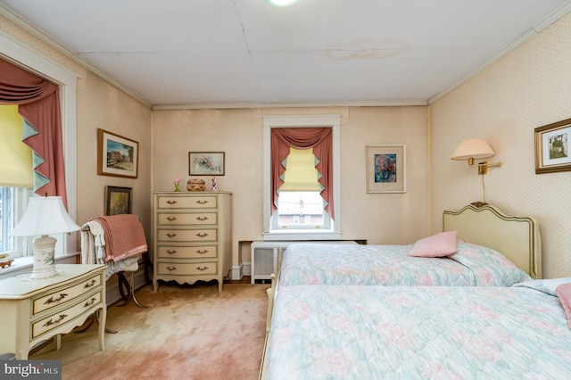 bedroom with crown molding and light carpet