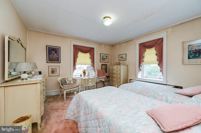 bedroom with crown molding and light carpet