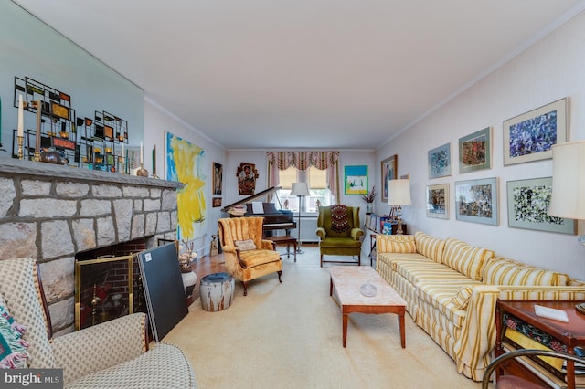 carpeted living room with crown molding and a fireplace