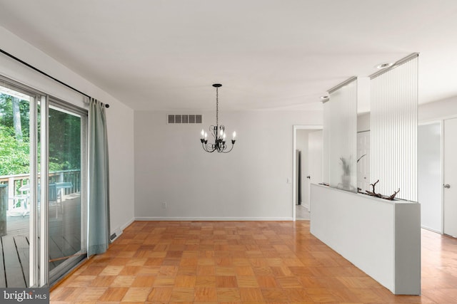 unfurnished dining area with light parquet flooring and a notable chandelier