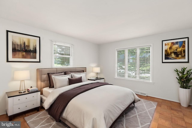 bedroom featuring parquet floors