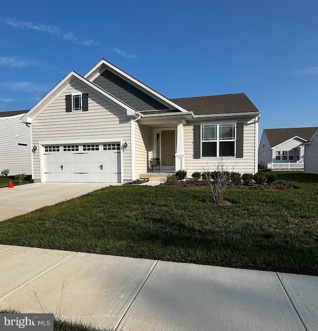 view of front of house with a front yard and a garage