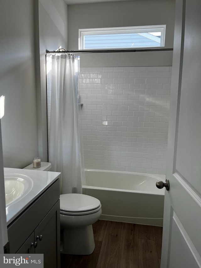 full bathroom featuring shower / bath combo, toilet, vanity, and wood-type flooring