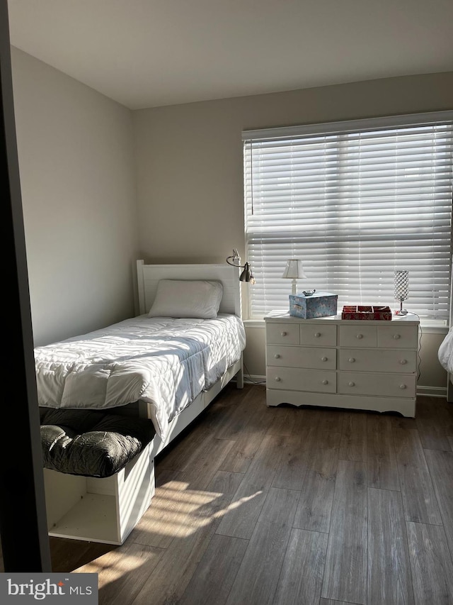 unfurnished bedroom featuring hardwood / wood-style flooring