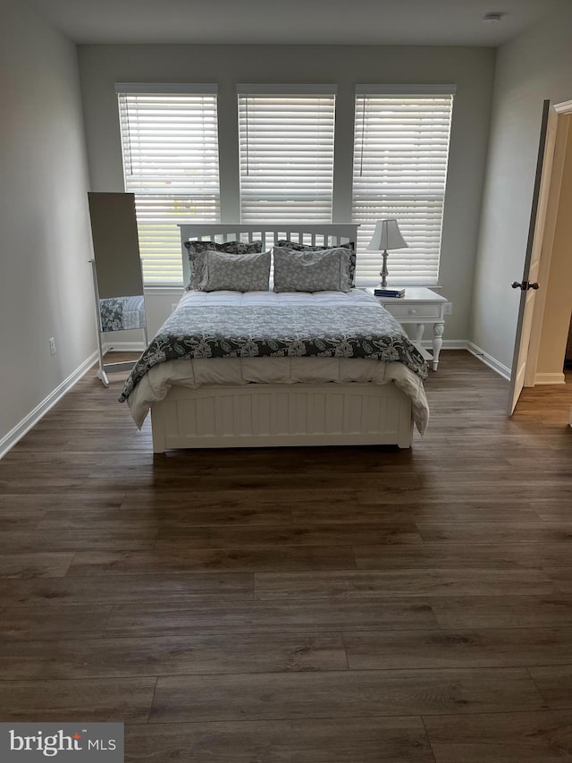 bedroom with hardwood / wood-style floors