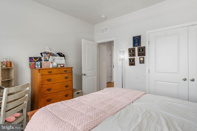 bedroom featuring hardwood / wood-style flooring and a closet