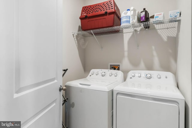 washroom with washing machine and dryer