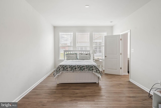 bedroom with hardwood / wood-style floors