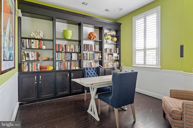 office featuring dark wood-type flooring and a healthy amount of sunlight