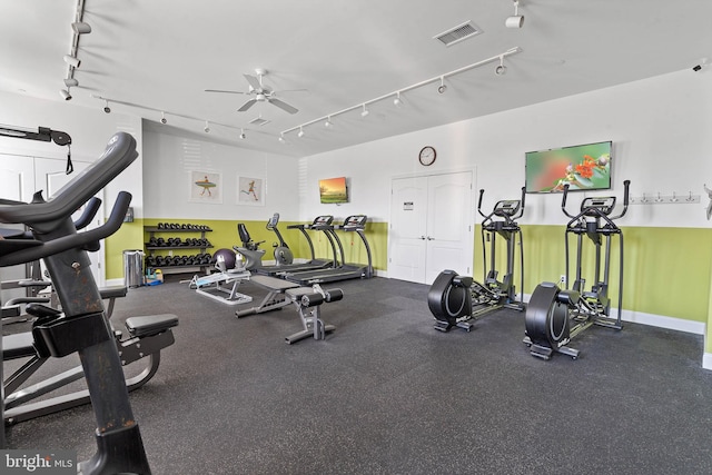 workout area featuring ceiling fan and rail lighting