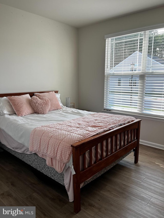 bedroom with hardwood / wood-style flooring