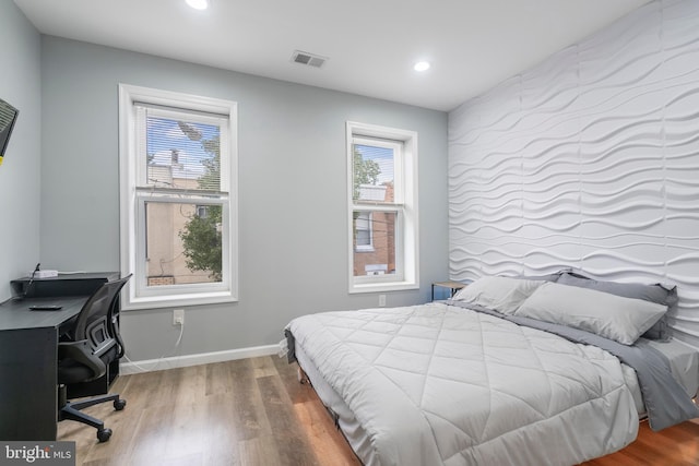 bedroom featuring hardwood / wood-style flooring