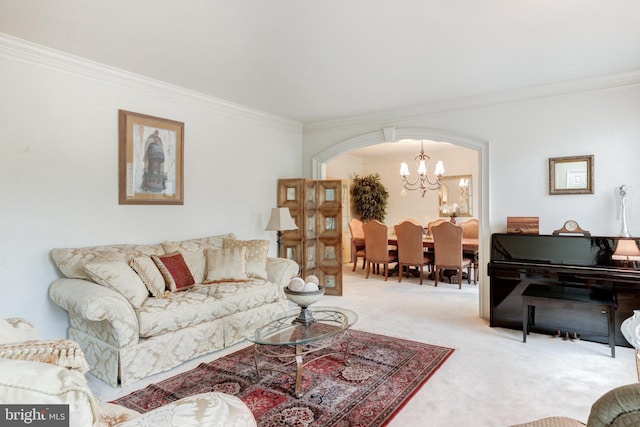 living room featuring carpet, crown molding, and a notable chandelier