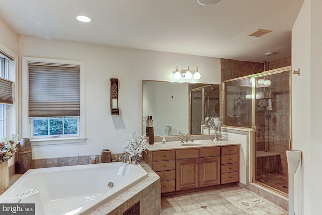 bathroom featuring vanity, plus walk in shower, and tile patterned floors