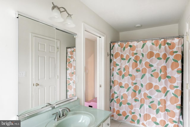 bathroom with tile patterned flooring, vanity, and a shower with shower curtain