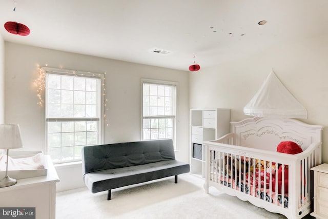 bedroom with light colored carpet