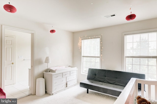 living area featuring light colored carpet