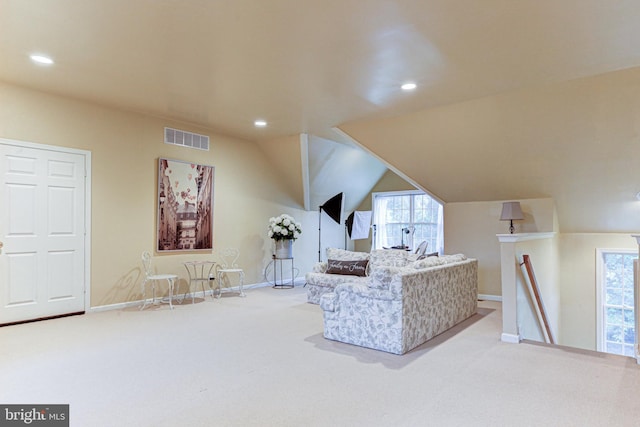 living area featuring carpet floors, visible vents, vaulted ceiling, and recessed lighting