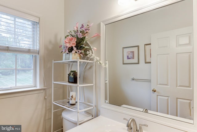 bathroom with toilet and a sink